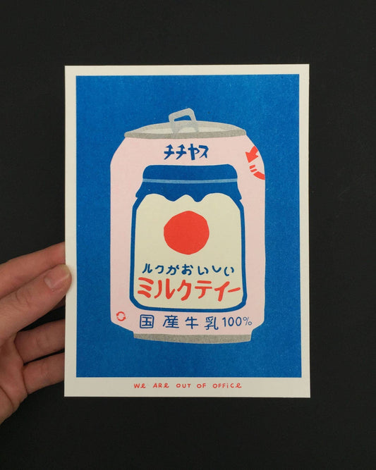 A risograph print of a japanese can of milky tea from a vending machine.